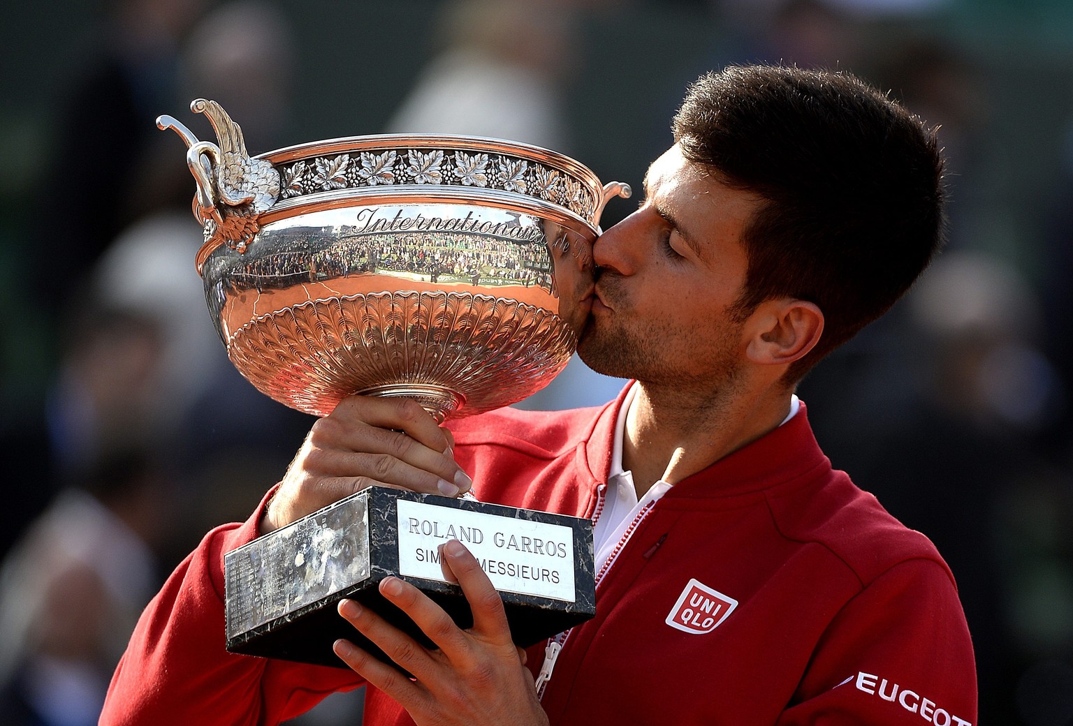 epa05347602 Novak Djokovic of Serbia poses with the trophy after winning against Andy Murray of Britain their men&#039;s single final match at the French Open tennis tournament at Roland Garros in Par ...