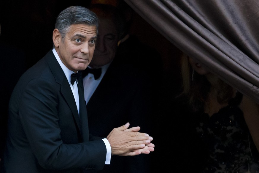 FILE - In this Sept. 27, 2014 file photo, George Clooney arrives at the Aman hotel in Venice, Italy. Clooney made an appearance at New York Comic Con, Thursday, Oct. 9, 2014 for a panel on his upcomin ...
