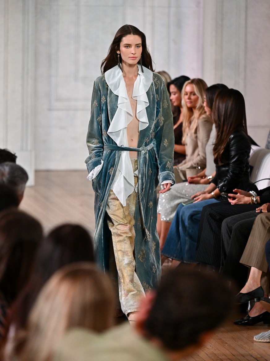 A model walks the runway during the Ralph Lauren Spring/Summer 2027 presentation as part of New York Fashion Week on Wednesday, Sept. 9, 2026, in New York. (Photo by Evan Agostini/Invision/AP)
NYFW -  ...