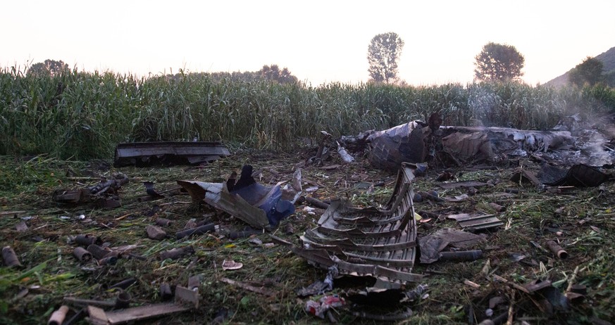 epa10075685 The wreckage of an Antonov An-12 aircraft that crashed near Antiphilippi, Kavala, northern Greece, 17 July 2022. The cargo plane crashed on the night of 16 July with eight crew members onb ...