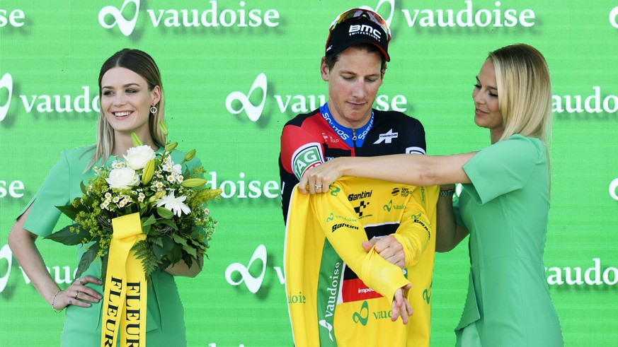 Overall leader Stefan Kueng from Switzerland of BMC Racing Team puts on the yellow jersey after the 2nd stage, a 155 km round course, of the 82th Tour de Suisse UCI ProTour cycling race in Frauenfeld, ...