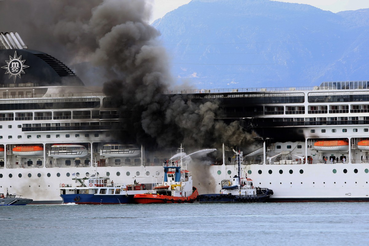 epa09069960 A fire broke out on the 'MSC Lirica' cruiseship on 12 March 2021, while it was tied at the Corfu port, Ionian Sea, Greece, since January 30 for the winter season. Onboard were cr ...