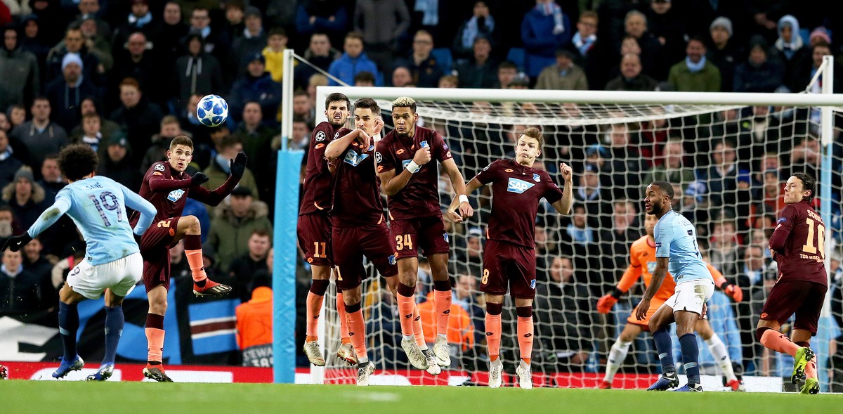 epa07226935 Manchester City's Leroy Sane (L) scores the 1-1 equalizer during the UEFA Champions League group H soccer match between Manchester City and 1899 Hoffenheim in Manchester, Britain, 12  ...