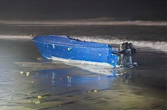 This photo provided by the Defense Visual Information Distribution Service shows a capsized boat on Friday, Nov. 14, 2025, off the coast of Imperial Beach, Calif. (Petty Officer 3rd Class Roberto Niev ...