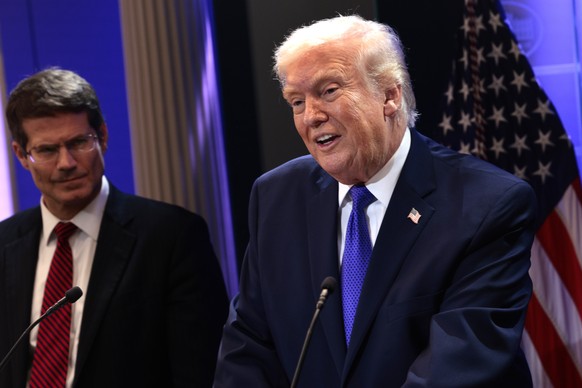 epa12763017 US President Donald J. Trump (R) speaks about the Supreme Court's striking down of most of his tariffs during a press conference in the briefing room at the White House in Washington, ...
