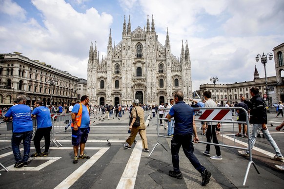 epa10688919 A worker carries a fence ahead of former Italian Prime Minister Silvio Berlusconi&#039;s state funeral in Duomo&#039;s square in Milan, Italy, 13 June 2023. Silvio Berlusconi died at the a ...