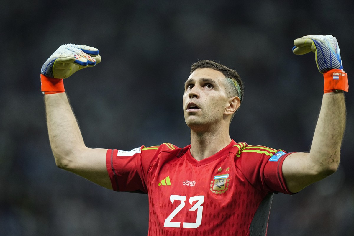 Argentina's goalkeeper Emiliano Martinez celebrates at the end of the World Cup quarterfinal soccer match between the Netherlands and Argentina, at the Lusail Stadium in Lusail, Qatar, Saturday,  ...