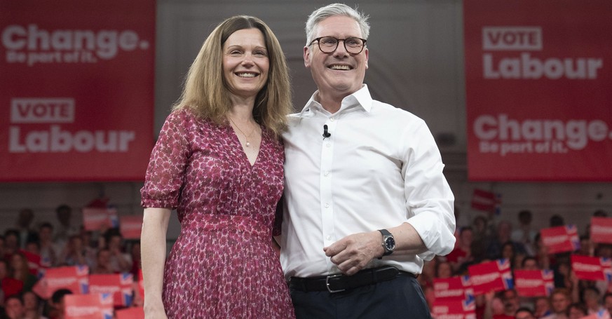 Labour leader Sir Keir Starmer, with his wife, Victoria,, on stage after he spoke at a major campaign event at the Royal Horticultural Halls in central London, while on the General Election campaign t ...