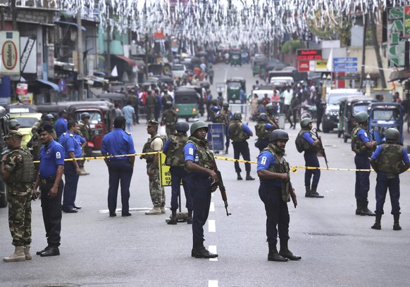 Sri Lankan Naval soldiers stand guard as authorities started clearing the debris from inside of the damaged St. Anthony&#039;s Church after it was targeted in a series of Islamic State-claimed suicide ...