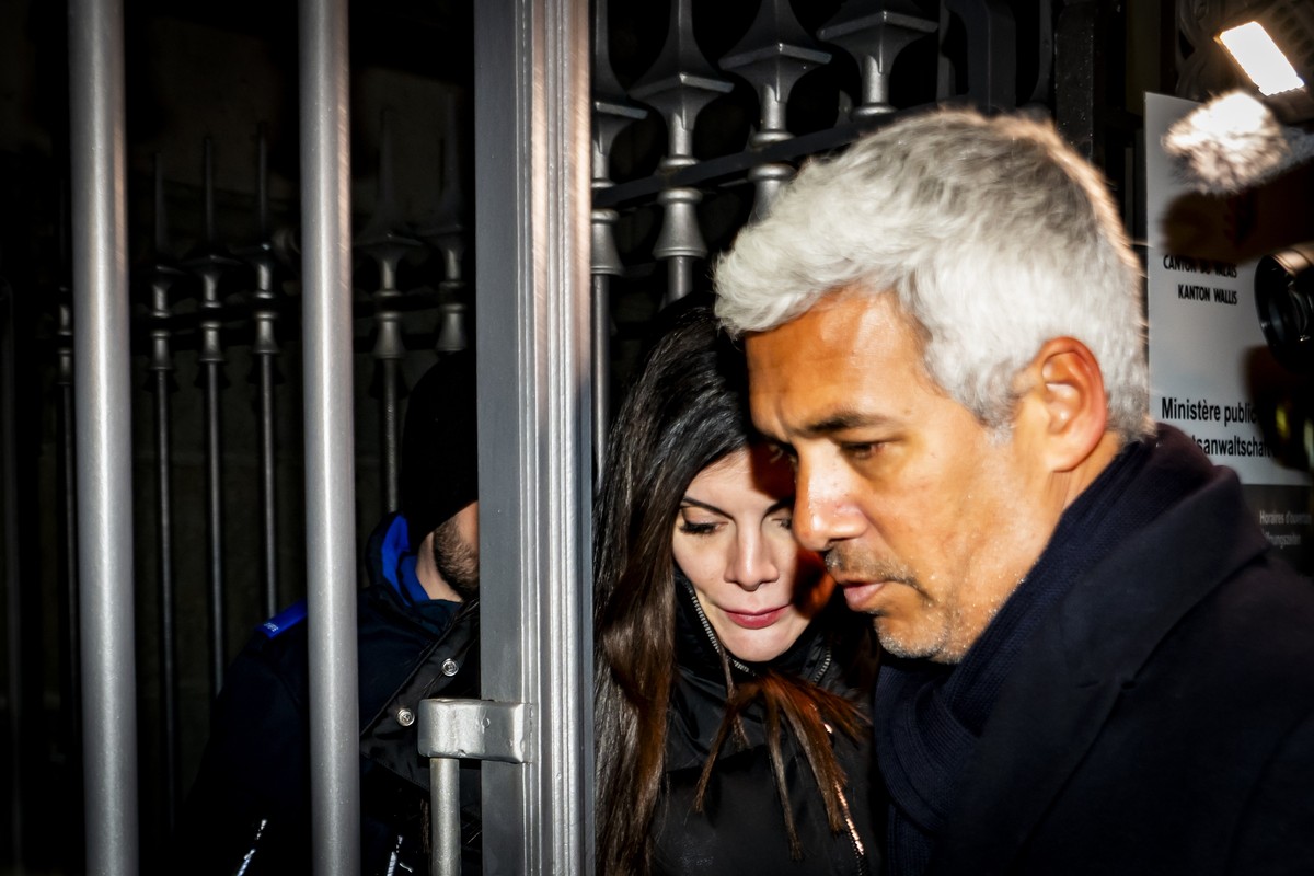 epa12668383 Jessica Moretti (L), French owner of the bar in Crans-Montana, where the deadly fire happened on New Year's Day, leaves with lawyer Nicola Meier (R), the Valais public prosecutor' ...
