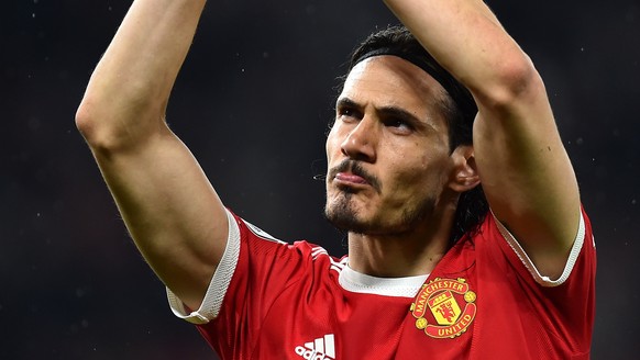 epa09923260 Edinson Cavani of Manchester United applauds fans at the end of the English Premier League soccer match between Manchester United and Brentford FC in Manchester, Britain, 02 May 2022. EPA/ ...