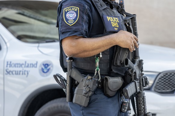 epa11608343 A Homeland Security officer stands outside the Paul G. Rogers Federal Building and US Courthouse where Ryan Wesley Routh, identified as the suspect who was arrested after allegedly pointin ...