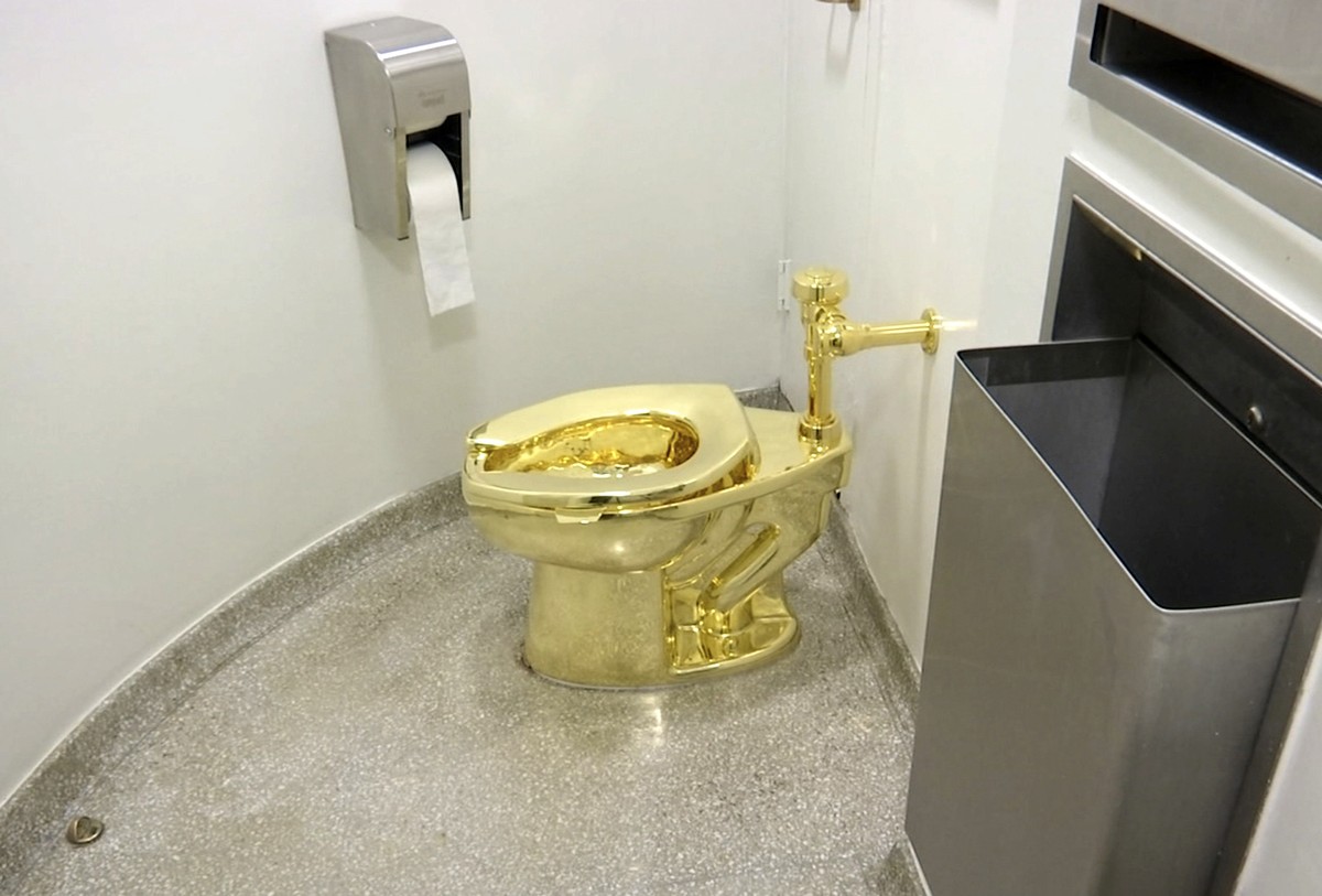 FILE - This Sept. 16, 2016 file image made from a video shows the 18-karat toilet, titled "America," by Maurizio Cattelan in the restroom of the Solomon R. Guggenheim Museum in New York. Thi ...