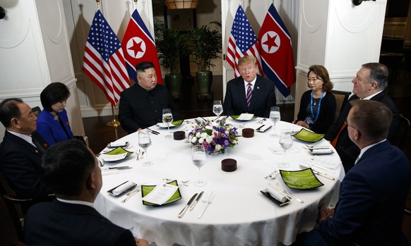 President Donald Trump speaks during a dinner with North Korean leader Kim Jong Un, Wednesday, Feb. 27, 2019, in Hanoi. Seated on right are acting White House Chief of Staff Mick Mulvaney, Secretary o ...