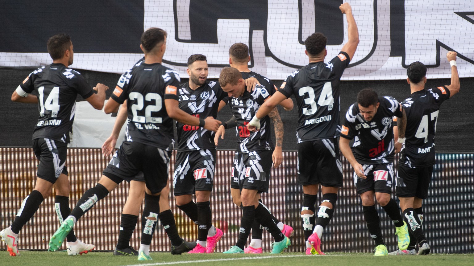 Lugano?s player Zan Celar celebrates with team mates the 1 - 0 goal, during the Super League soccer match FC Lugano against FC St. Gallen, at the Cornaredo Stadium in Lugano, Saturday, July 29, 2023.  ...