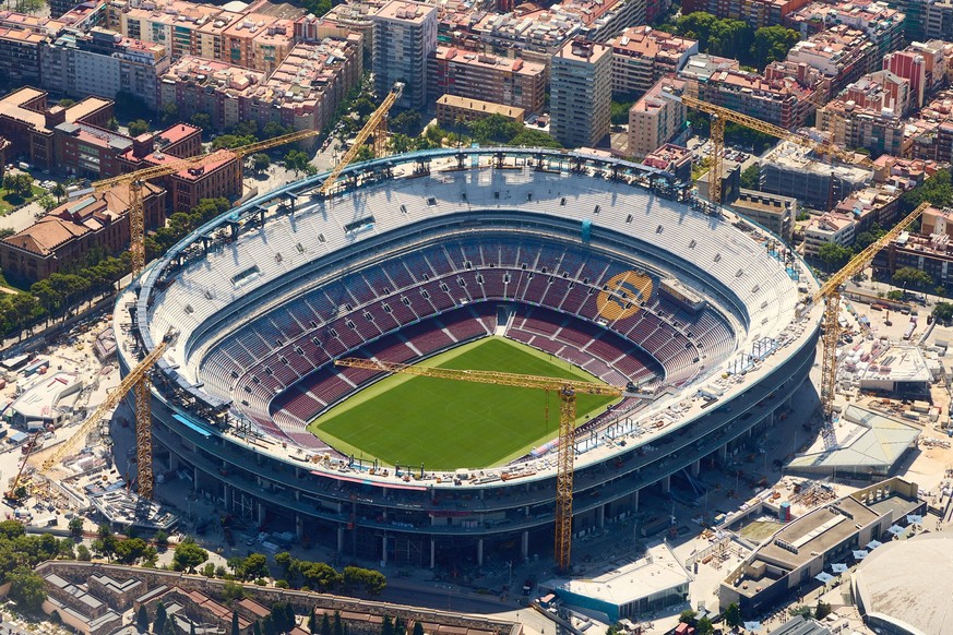 260618 -- BARCELONA, June 18, 2026 -- An aerial photo taken on June 18, 2026 shows the Camp Nou stadium in Barcelona, Spain. Barcelona displays its distinctive grid layout, with the Sagrada Familia Ba ...