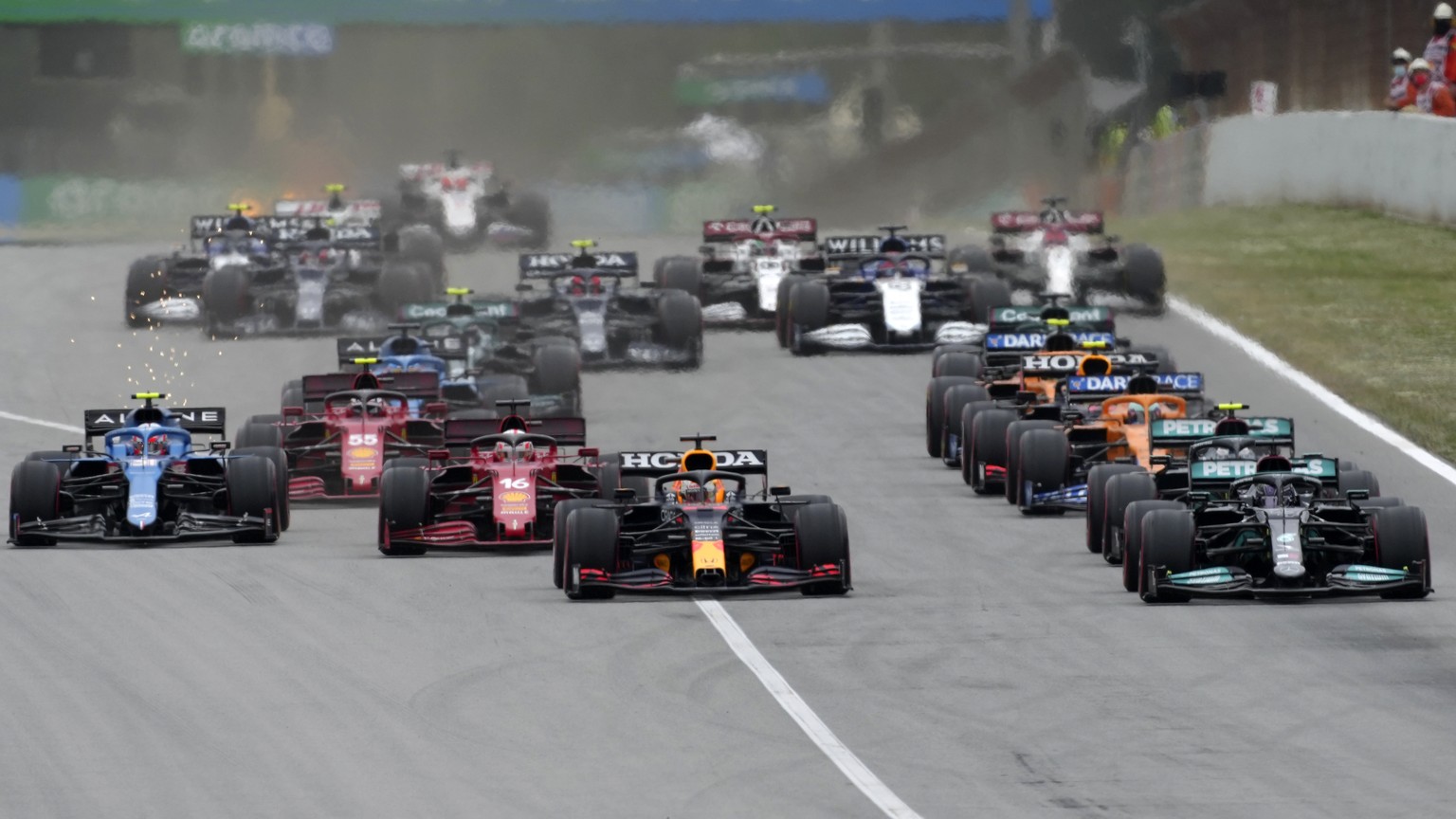 Red Bull driver Max Verstappen of the Netherlands, center, and Mercedes driver Lewis Hamilton of Britain, right, start the Spanish Formula One Grand Prix at the Barcelona Catalunya racetrack in Montme ...