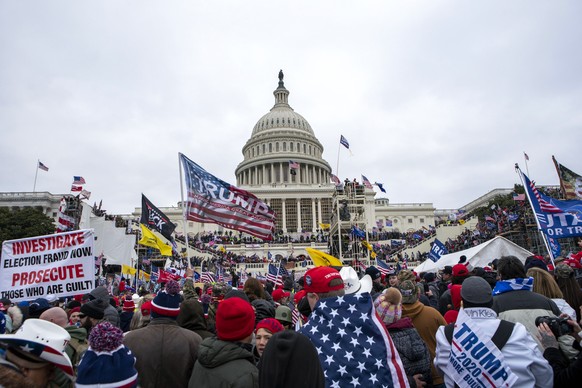 FILE - Rioters loyal to President Donald Trump rally at the U.S. Capitol in Washington on Jan. 6, 2021. The House committee investigating the Jan. 6 attack on the U.S. Capitol has scheduled its next h ...