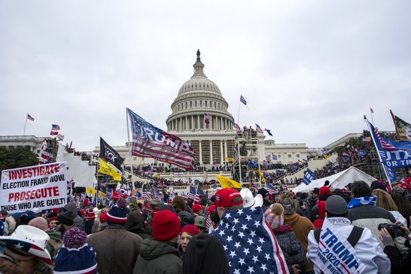 TILE - Rioters loyal to President Donald Trump gather at the U.S. Capitol in Washington on January 6, 2021.  The House committee investigating the Jan. 6 attack on the U.S. Capitol has released its next h...