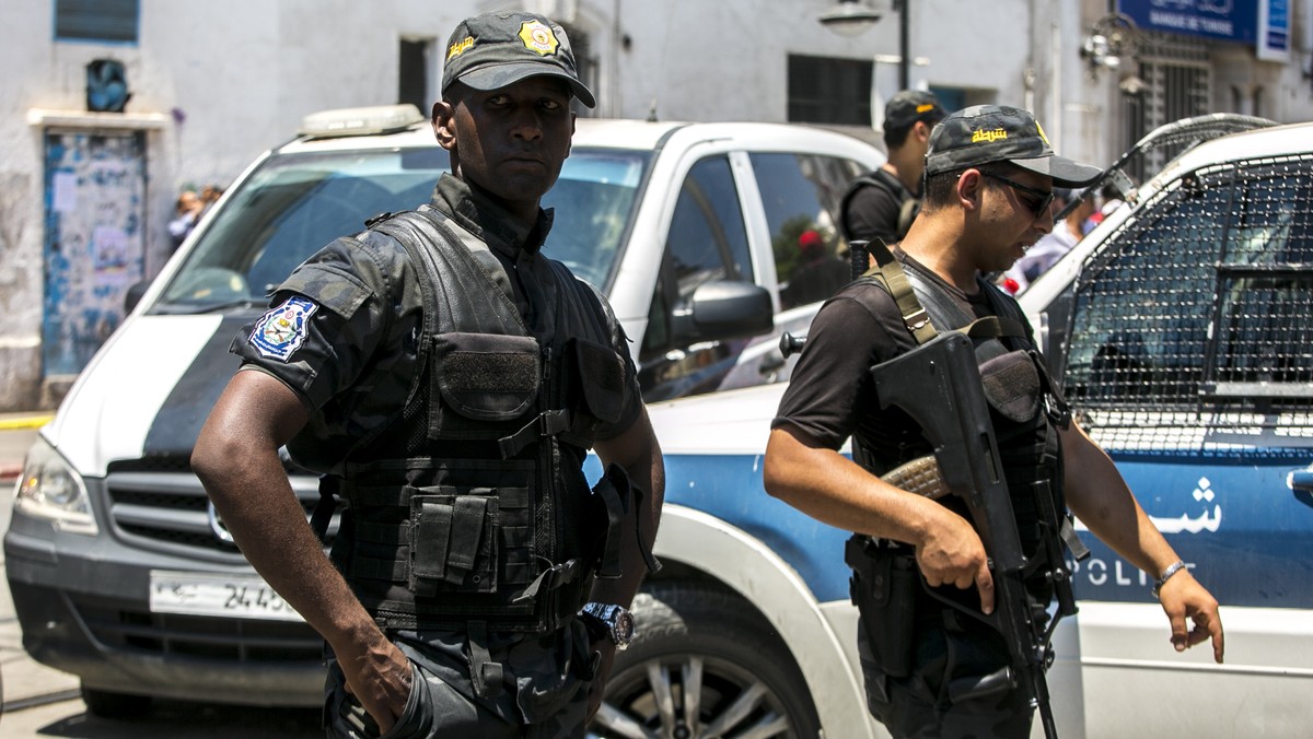 Tunisian police officers stand guard after an explosion in Tunis, Thursday June 27, 2019. Twin suicide attacks targeting security forces struck Tunisia's capital on Thursday, killing at least one ...