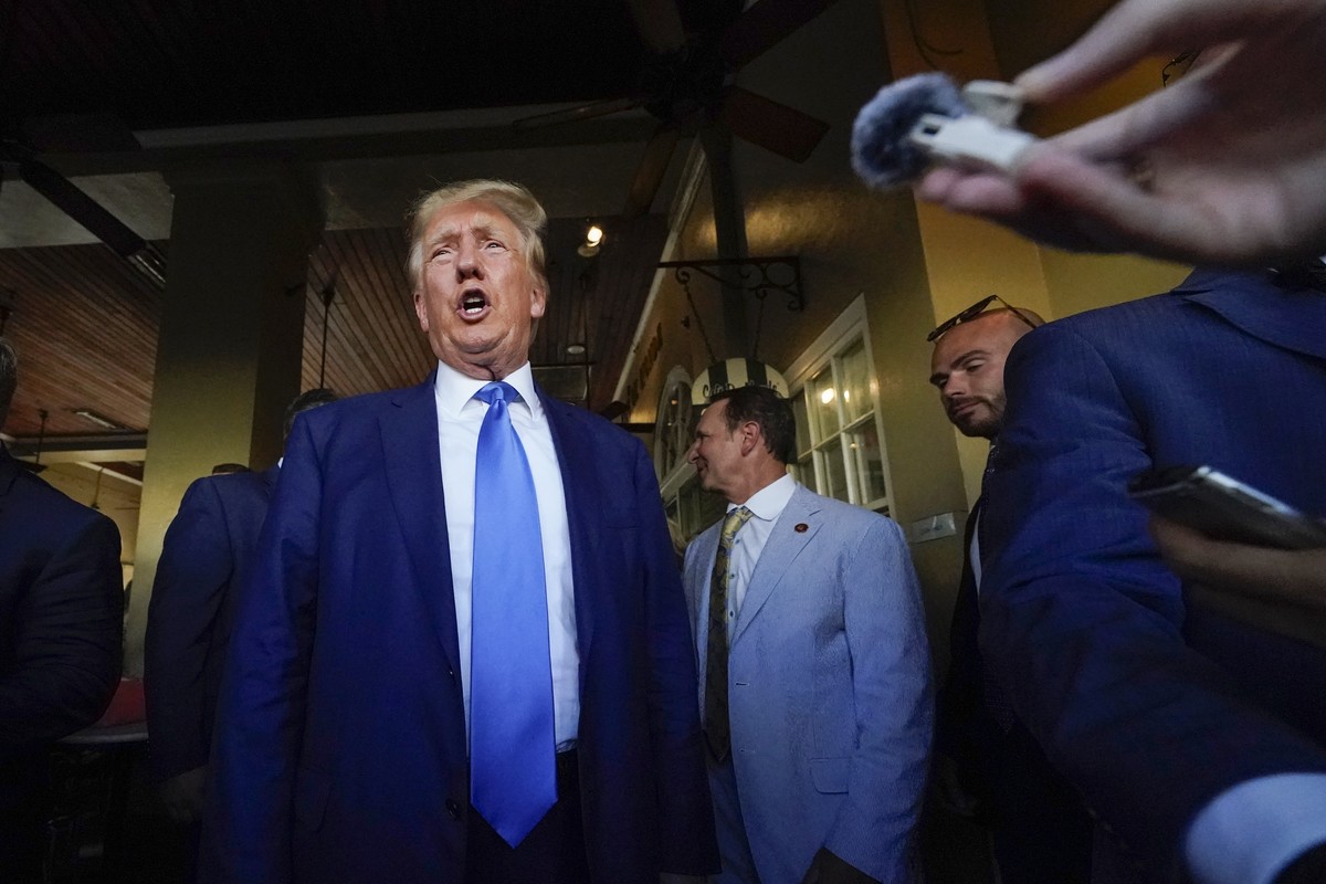 FILE - Former President Donald Trump visits Caf