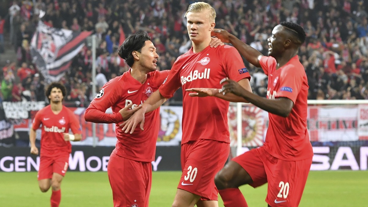 Salzburg's Erling Braut Haaland, second right, celebrates his goal before it is canceled by the video referee during the Champions League Group E soccer match between FC Red Bull Salzburg and Nap ...