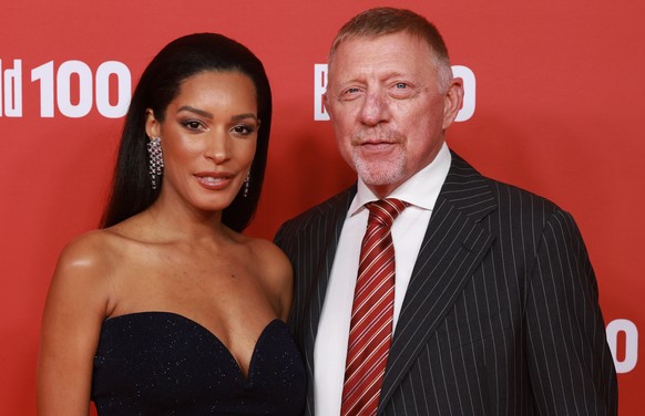 epa12388216 German former tennis player Boris Becker (R) and his partner Lilian de Carvalho attend the Bild100 reception in Berlin, Germany, 18 September 2025. Leading decision makers in politics, eco ...