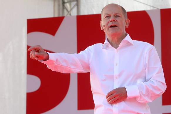 epa09432465 German Minister of Finance and Social Democratic Party (SPD) top candidate for the federal elections Olaf Scholz delivers a speech during an election rally of the Social Democratic Party ( ...