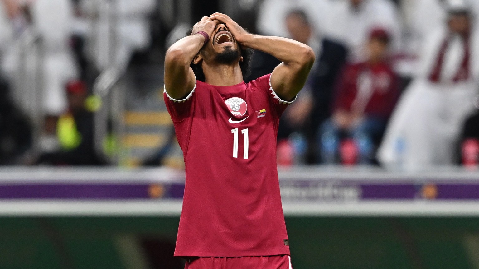 epa10316502 Akram Afif of Qatar reacts during the FIFA World Cup 2022 group A Opening Match between Qatar and Ecuador at Al Bayt Stadium in Al Khor, Qatar, 20 November 2022. EPA/Noushad Thekkayil