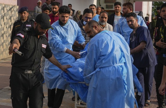 Paramedics carry a wounded tourist on a stretcher at a hospital in Anantnag after assailants indiscriminately fired at tourists visiting Pahalgam, Indian controlled Kashmir, Tuesday, April 22, 2025.(A ...