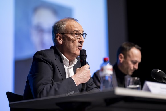 Swiss Federal President Guy Parmelin, left, speaks next to Mathias Reynard, State Councillor and president of the Council of State of the Canton of Valais during a press conference about the Le Conste ...
