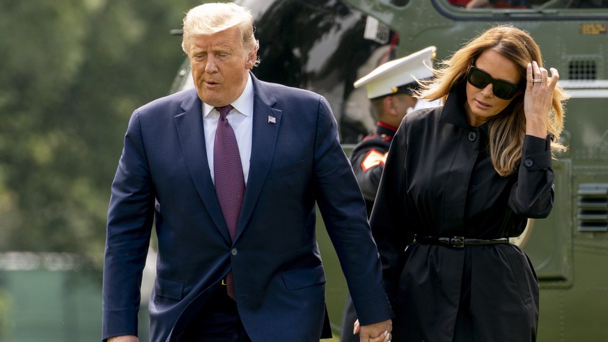 President Donald Trump and first lady Melania Trump arrive on the South Lawn of the White House in Washington, Friday, Sept. 11, 2020, after returning from the Flight 93 National Memorial in Shanksvil ...