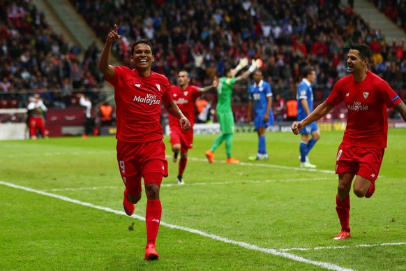 WARSAW, POLAND - MAY 27: Carlos Bacca of Sevilla celebrates scoring his team&#039;s third goal with Vitolo of Sevilla during the UEFA Europa League Final match between FC Dnipro Dnipropetrovsk and FC  ...