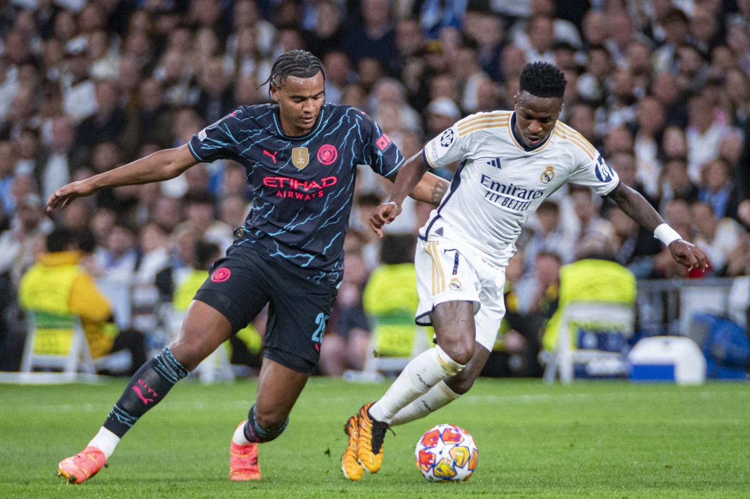 UEFA Champions League 2023/24 Quarter-final First Leg: Real Madrid CF v Manchester City Vinicius Junior of Real Madrid R in action against Manuel Akanji of Manchester City L during the UEFA Champions  ...