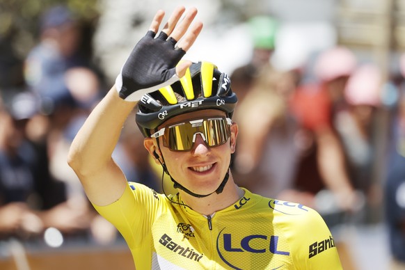 epa10066487 The Yellow Jersey Slovenian rider Tadej Pogacar of UAE Team Emirates gestures before the start of the 10th stage of the Tour de France 2022 over 148,5km from Morzine to Megeve France, 12 J ...