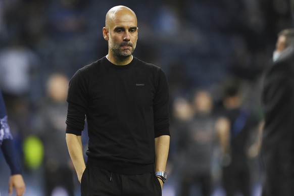 Manchester City&#039;s head coach Pep Guardiola reacts after the Champions League final soccer match between Manchester City and Chelsea at the Dragao Stadium in Porto, Portugal, Saturday, May 29, 202 ...