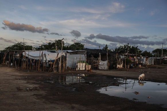 MAICAO, COLOMBIA - OCTOBER 28: Venezuelan migrants and Colombian returnees who survive in critical conditions of misery at the old Maicao airport are seen at Maicao, Colombia on October 28, 2022. The  ...