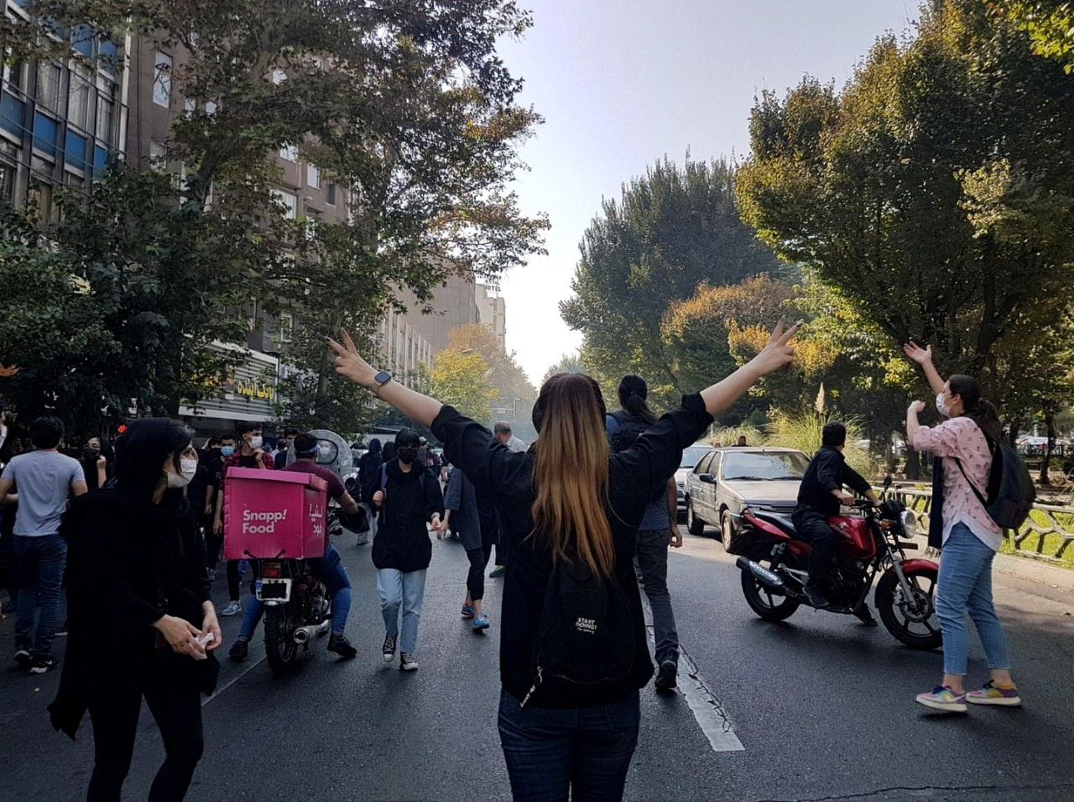 epa12198872 (FILE) - Protesters block a road during a protest over the death of young Iranian woman Mahsa Amini, who died last week after being arrested in Tehran for not wearing her hijab appropriate ...
