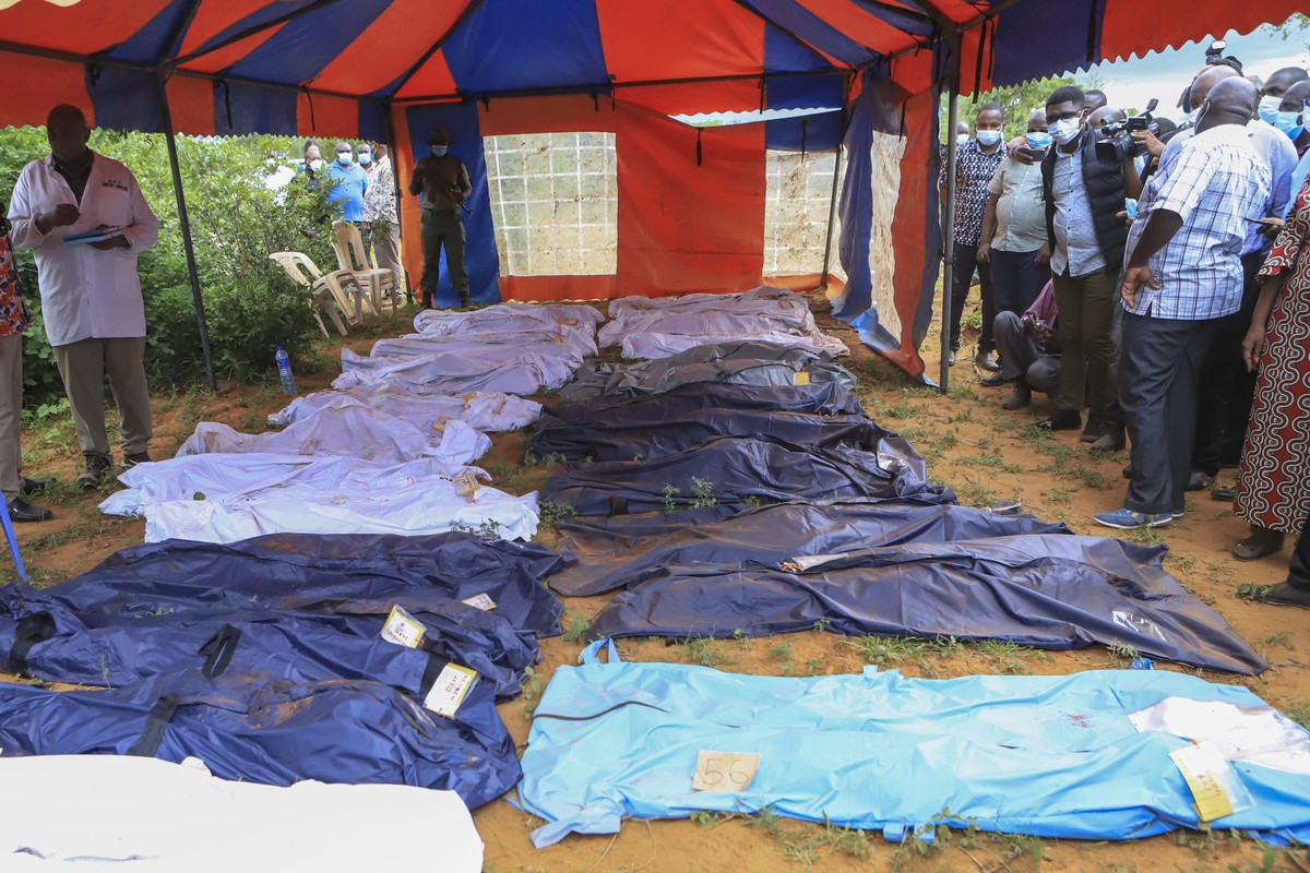Body bags are laid out at the scene where dozens of bodies have been found in shallow graves in the village of Shakahola, near the coastal city of Malindi, in southern Kenya Monday, April 24, 2023. Ke ...