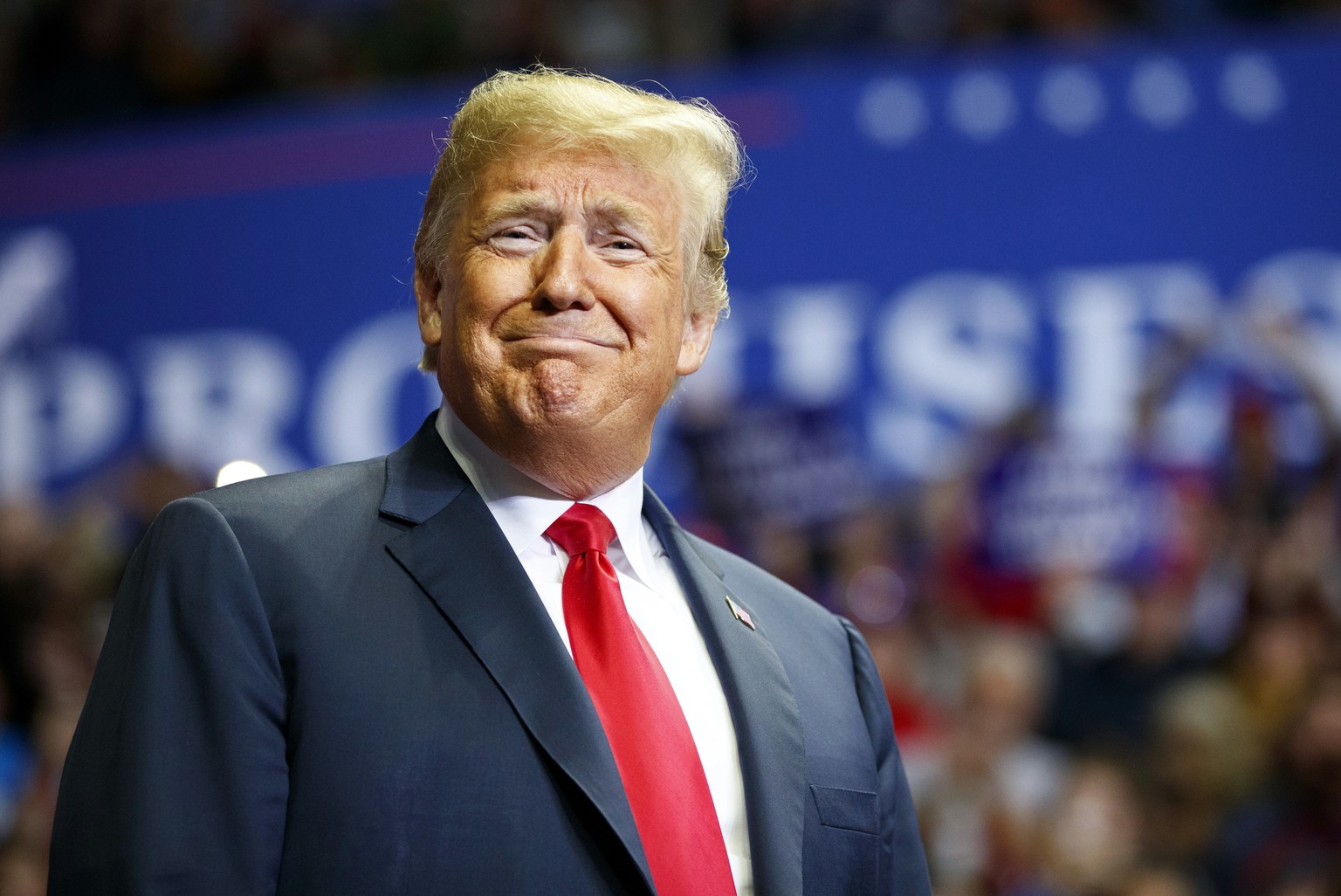 President Donald Trump looks to the cheering crowd as he arrives to speak at a rally at Allen County War Memorial Coliseum, Monday, Nov. 5, 2018, in Fort Wayne, Ind. (AP Photo/Carolyn Kaster)