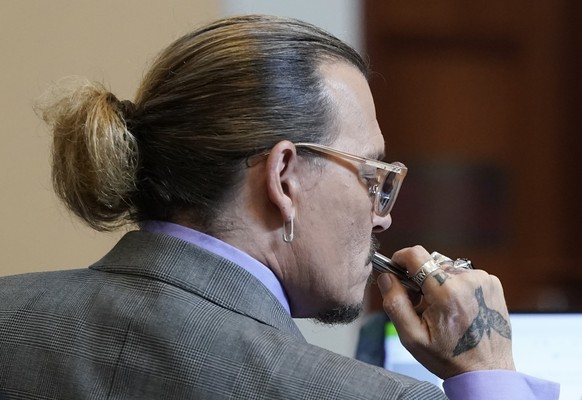 Actor Johnny Depp appears in the courtroom at the Fairfax County Circuit Court in Fairfax, Va., Wednesday May 4, 2022. Depp sued his ex-wife actor Amber Heard for libel in Fairfax County Circuit Court ...