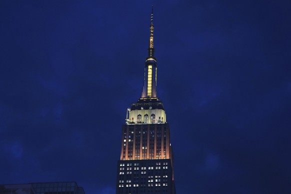 The Empire State Building is lit in gold and white in honor of Pope Leo XIV Thursday, May 8, 2025, in New York. (AP Photo/Frank Franklin II)
Vatican Conclave New Pope Reax New York