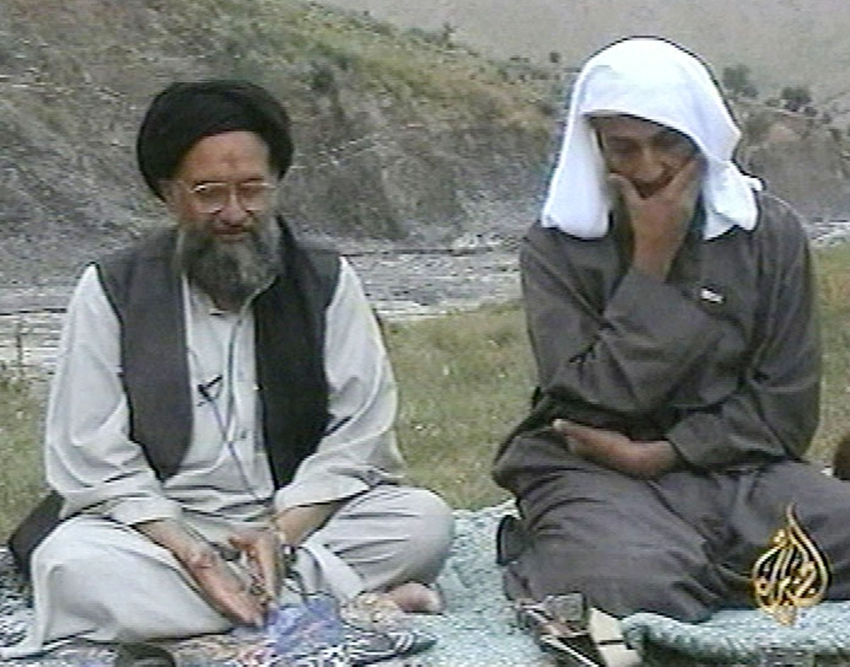 FILE - In this television image from Arab satellite station Al-Jazeera, Osama bin Laden, right, listens as his top deputy Ayman al-Zawahri speaks at an undisclosed location, in this image made from un ...