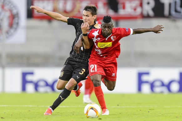 epa04935358 Kazan&#039;s Elmir Nabiullin (L) in action against Sion&#039;s Ebenezer Assifuah (R) during the UEFA Europa League group B soccer match between FC Sion and FC Rubin Kazan at Tourbillon Sta ...