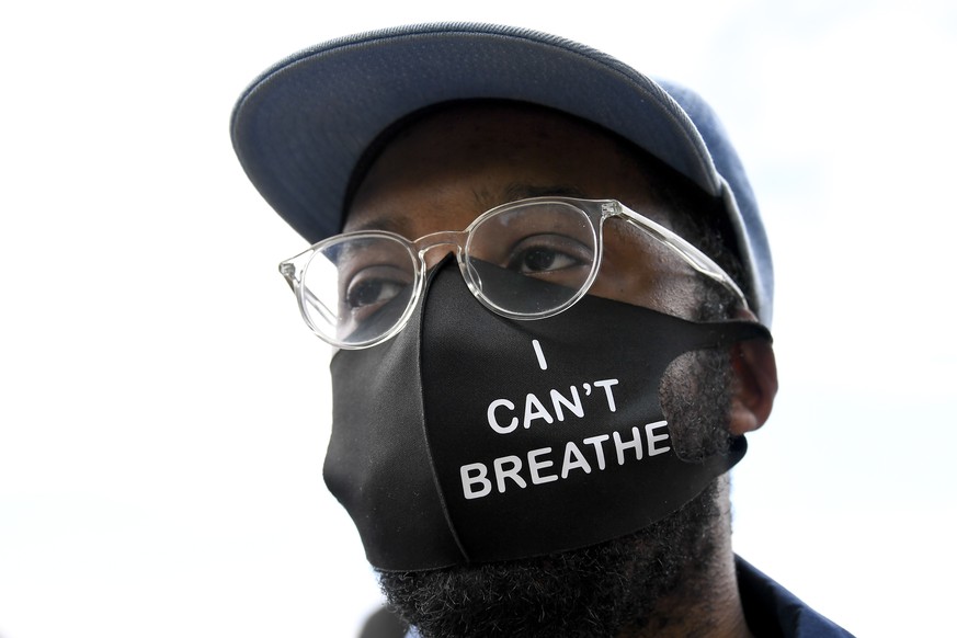 People attend a protest outside the US Embassy in London, Saturday, July 11, 2020, in the wake of the killing of George Floyd by police officers in Minneapolis, USA last month. (AP Photo/Alberto Pezza ...