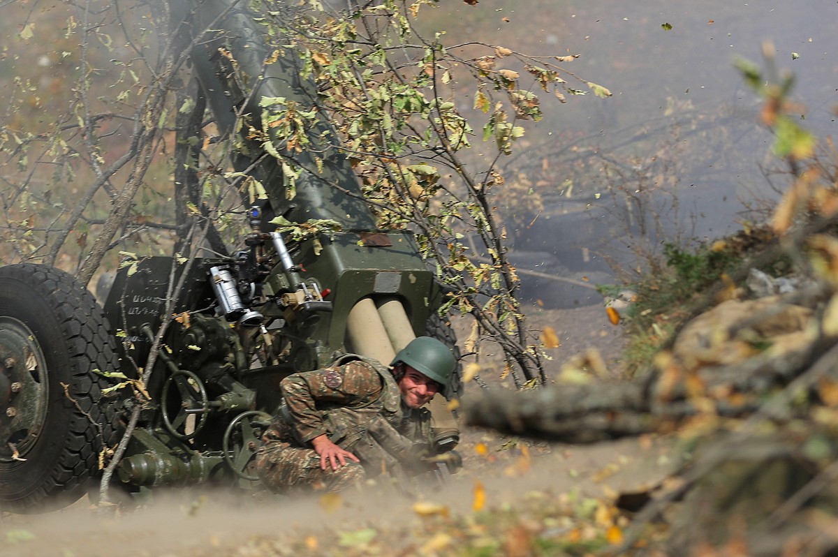 epa08761766 A picture provided by the Armenian Defense Ministry's Press Office via PAN Photo shows Armenian soldiers fire during military combat with the Azerbaijani army in the Nagorno-Karabakh  ...