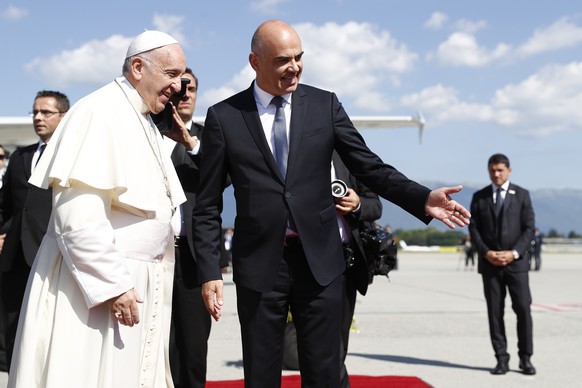 Pope Francis is welcomed by Swiss president Alain Berset, after his arrival in Geneva, Switzerland, Thursday, June 21, 2018. Pope Francis visit the World Council of Churches on 21 June as centrepiece  ...