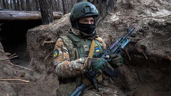 January 15, 2023, Donbas, Ukraine: A soldier takes position in a trench near the front in the Donbas. The military movement in the northern part of the Donbas is constant. At the moment the defensive  ...