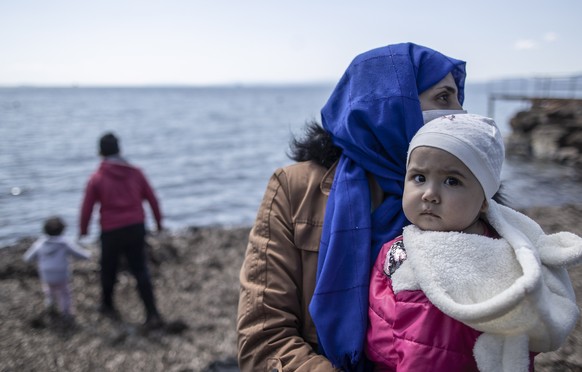 epa09131040 Migrants, who were allegedly pushed back from the Greece side, arrive at the Ayvalik district in Balikesir, Turkey, 10 April 2021 (issued 12 April 2012). The Greek island of Lesbos hosts o ...