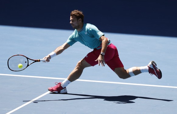 Switzerland&#039;s Stan Wawrinka makes a forehand return to France&#039;s Jo-Wilfried Tsonga during their quarterfinal at the Australian Open tennis championships in Melbourne, Australia, Tuesday, Jan ...